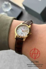 ساعت مچی زنانه تایمکس (Timex) مدل TW2R63600 (صفحه صدف، بند چرم قهوه‌ای، نور پس‌زمینه Indiglo) - تصویر 2